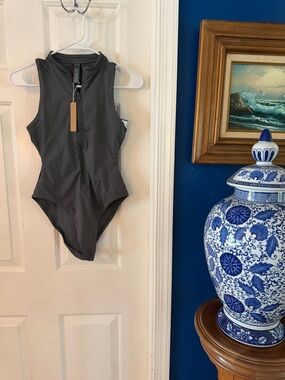 NWT Women’s Skims Swim Zip Front Sleeveless One Piece in a dark grey Size Small